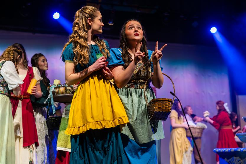 Actors perform onstage